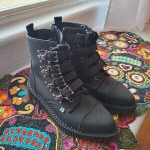 Black TUK vegan leather skull buckle pointed toe boots